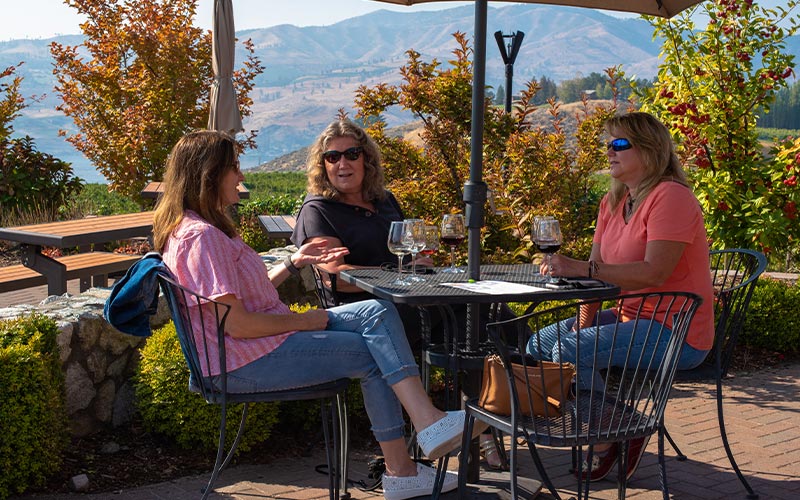 women enjoying wine at a table