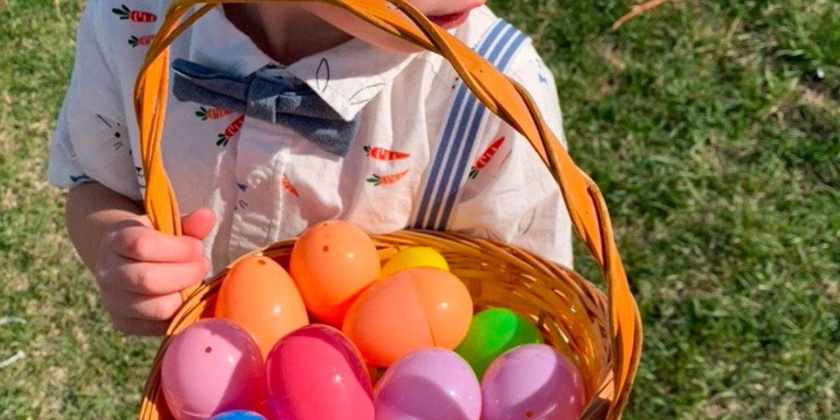 Child holding a basket of easter eggs