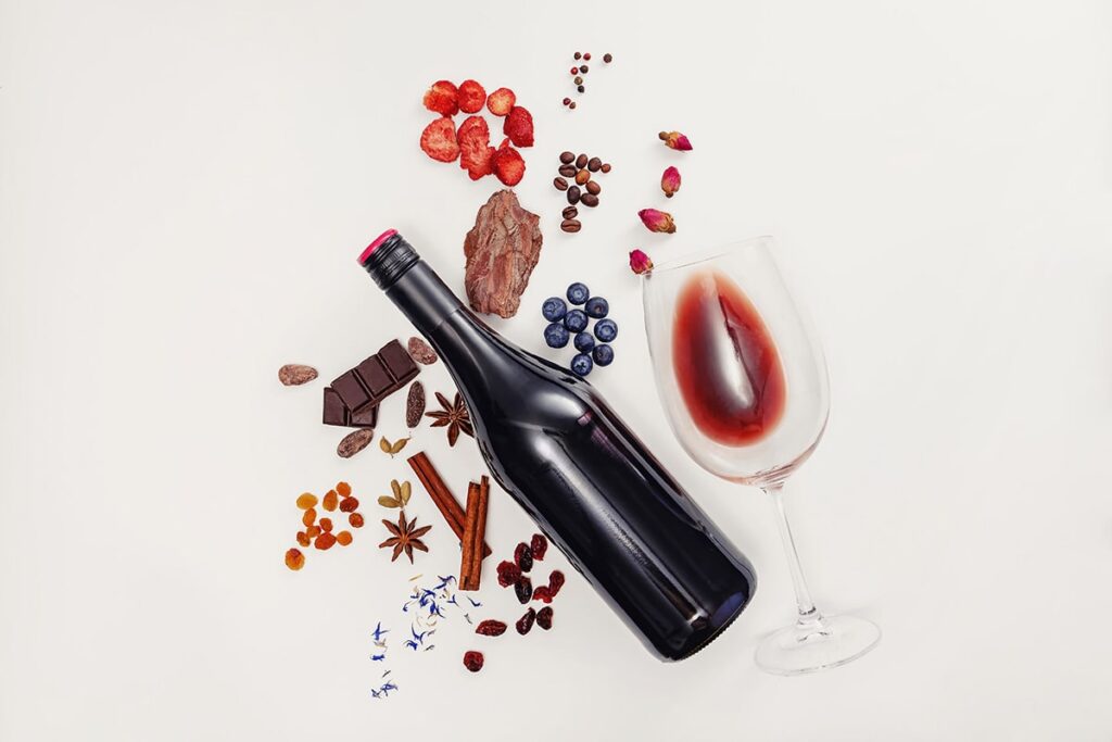 Composition with wine bottle, glass, and tannins of red wine