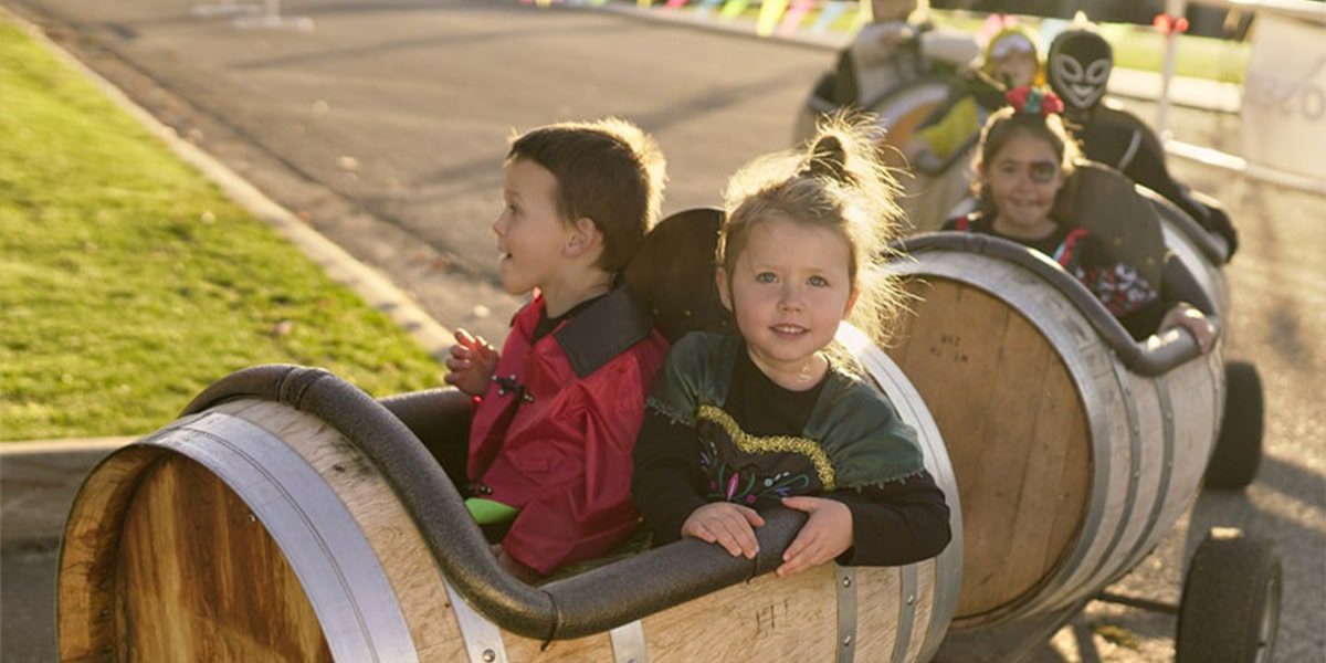 Kids taking a ride during the Haunted Manson barrel rides