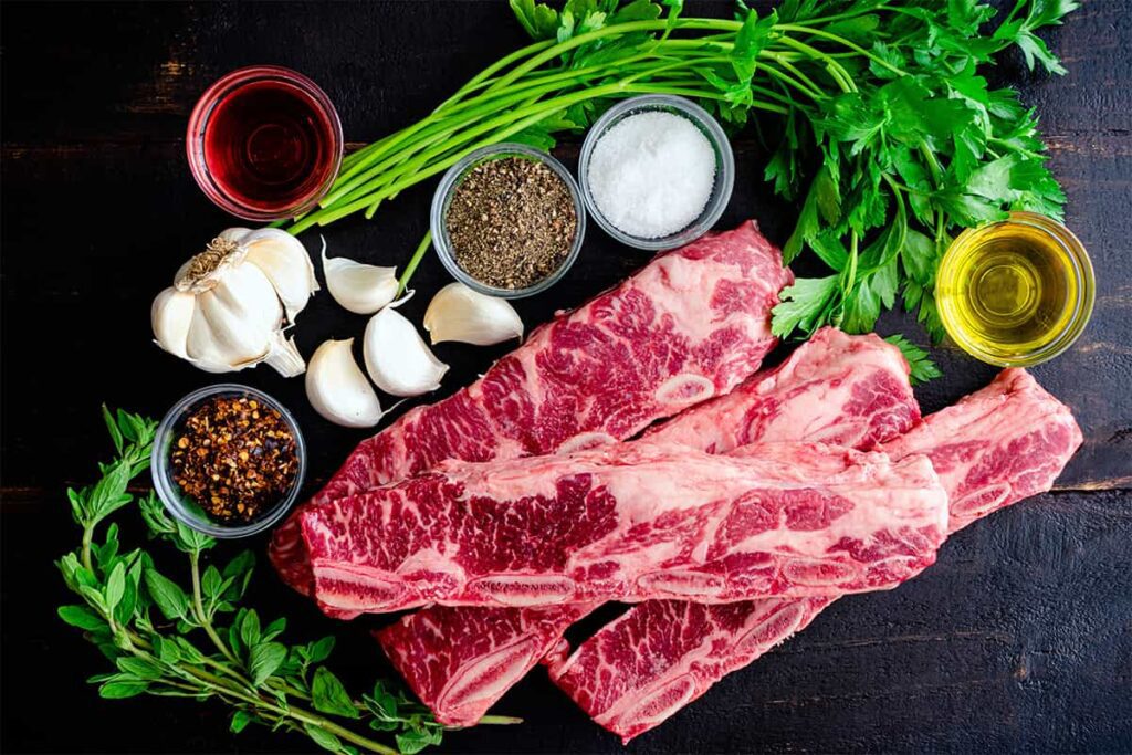 Preparing to cook short ribs with numerous ingredients for a wine pairing meal